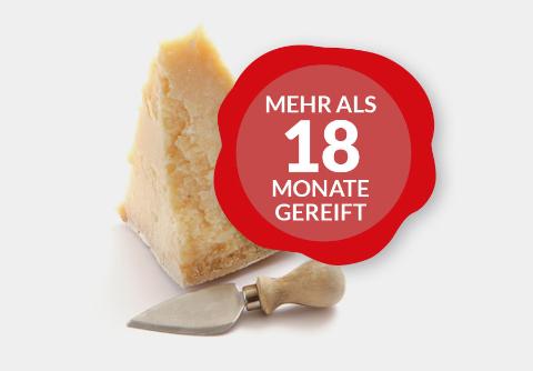 Hummerfarbenes Reifesiegel: Parmigiano-Reggiano, länger als 18 Monate gereift.